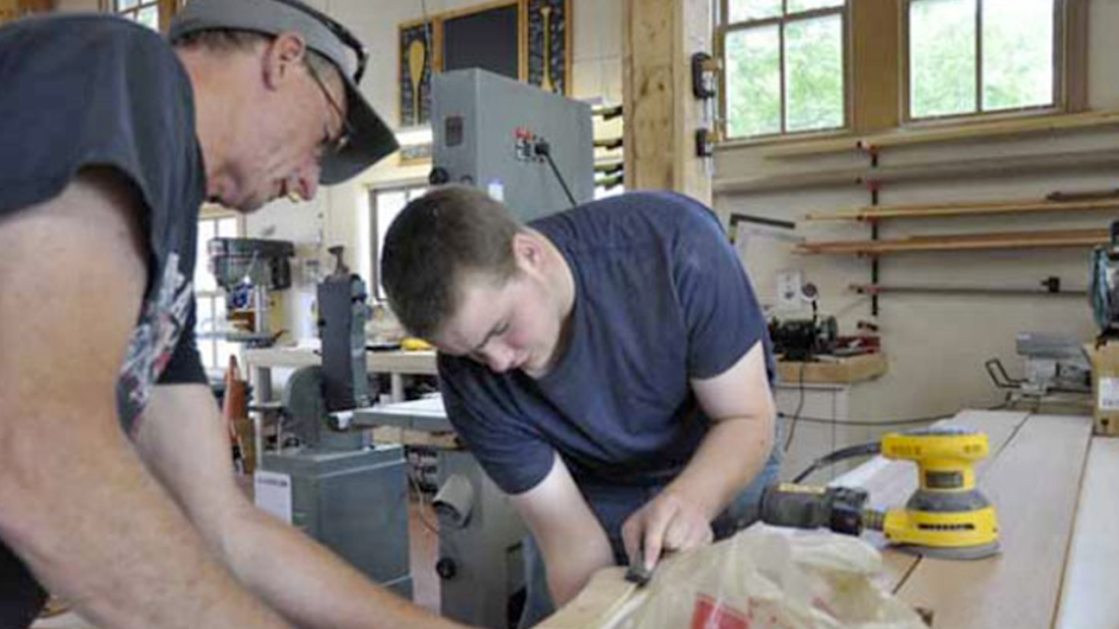 A local student learning how to build a boat!