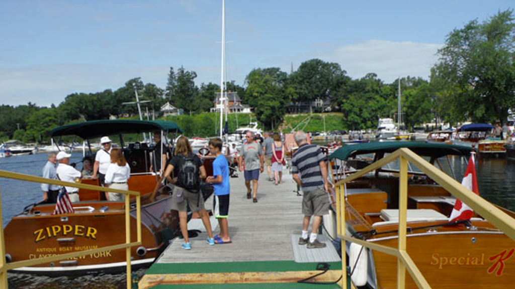 Summer visitors enjoying the boats out on the dock.